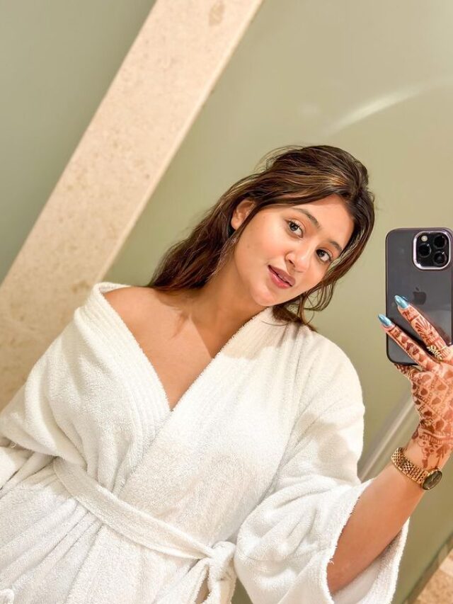 Anjali Arora taking selfie in white towel